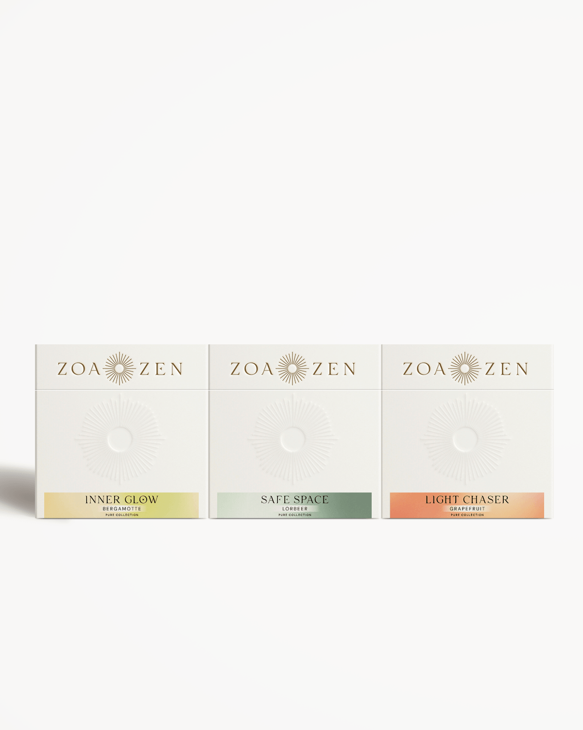 Zoa Zen Duftset mit Inner Glow, Safe Space und Light Chaser. Farbige Verpackungen in Weiß und Pastelltönen.